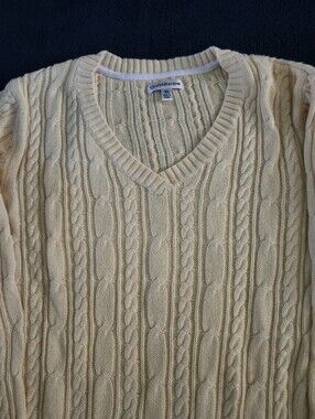 Cable-Knit V-Neck Sweater in off White.